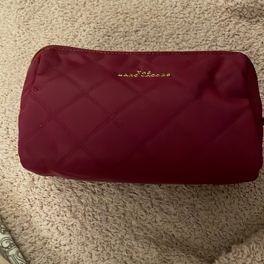 The Marc Jacobs magenta cosmetic bag